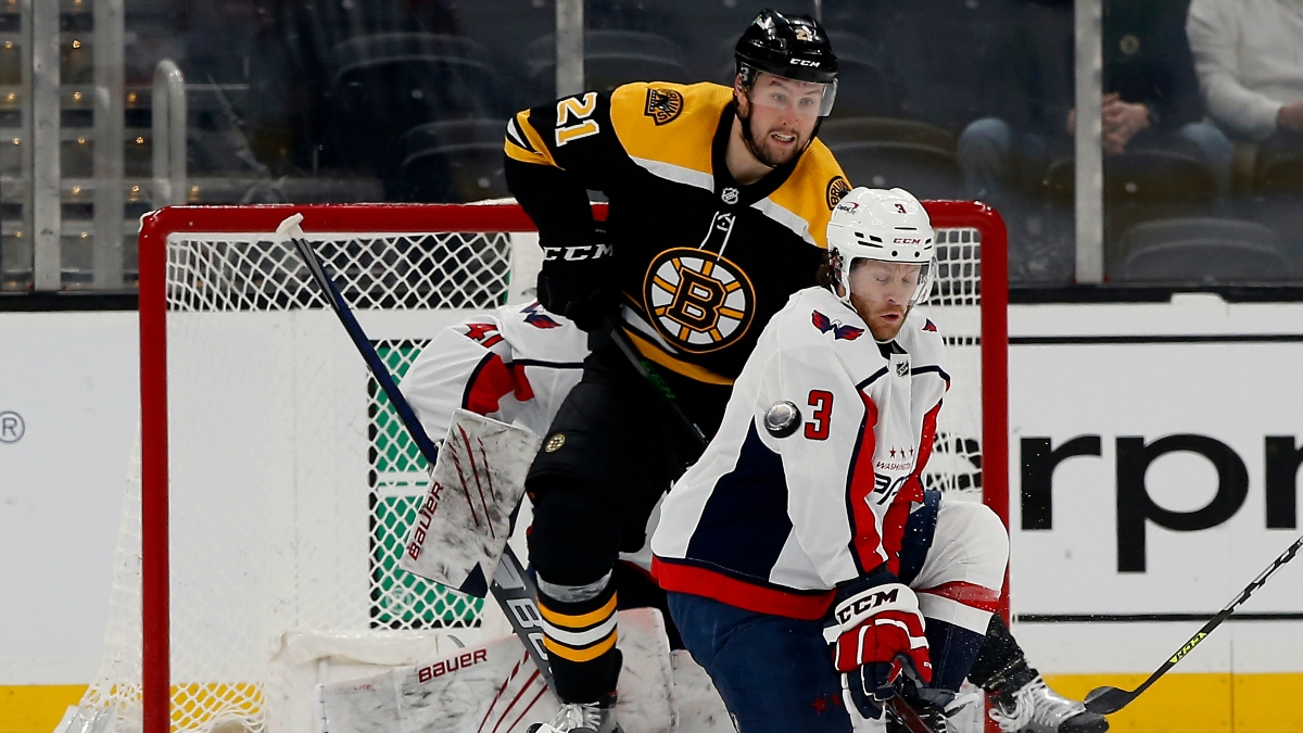 Washington Capitals defenseman Nick Jensen (3) and Boston Bruins left wing Nick Ritchie (21)