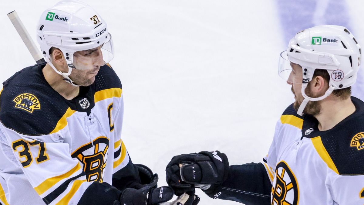 Boston Bruins Center Patrice Bergeron, Forward Nick Ritchie