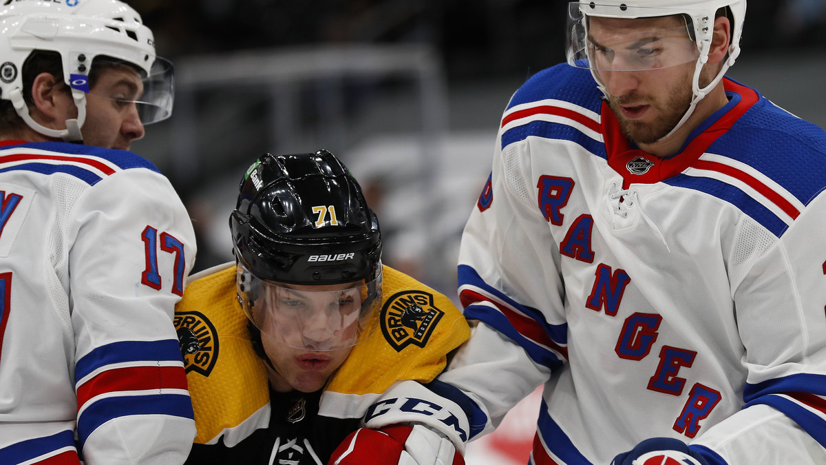 Boston Bruins winger Taylor Hall, New York Rangers forwards Tim Gettinger and Kevin Rooner