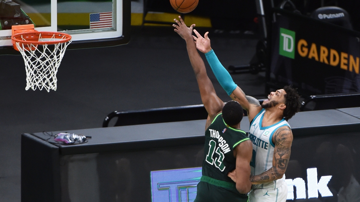 Boston Celtics center Tristan Thompson (13) and Charlotte Hornets forward Miles Bridges (0)