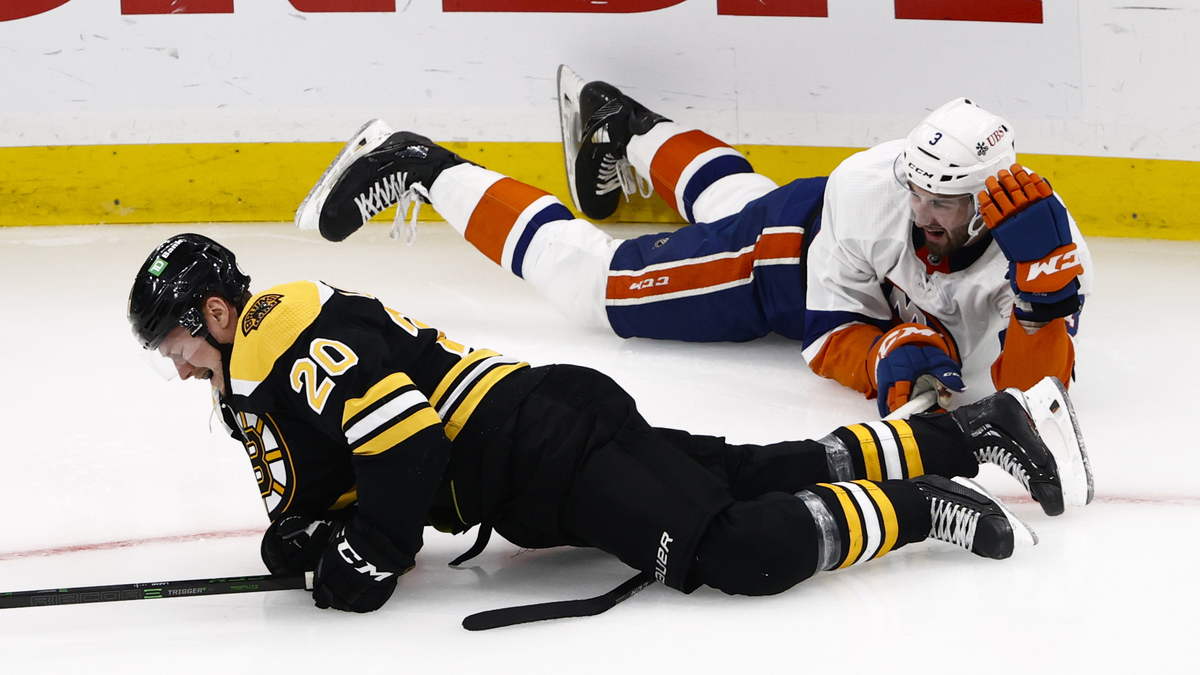 Boston Bruins center Curtis Lazar, New York Islanders defenseman Adam Pelech
