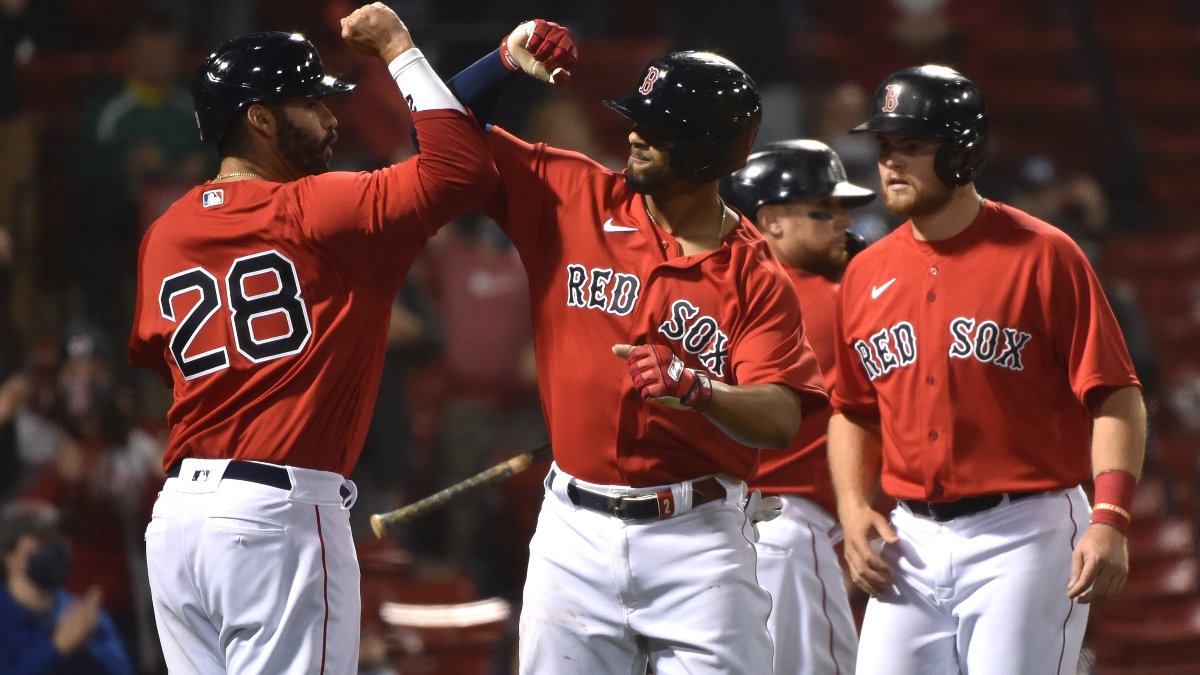 Red Sox left fielder J.D. Martinez (28) and shortstop Xander Bogaerts (2)