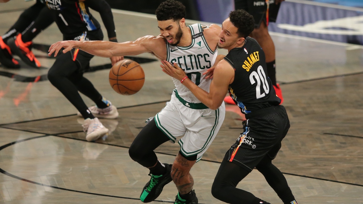 Boston Celtics small forward Jayson Tatum (0) and Brooklyn Nets shooting guard Landry Shamet (20)
