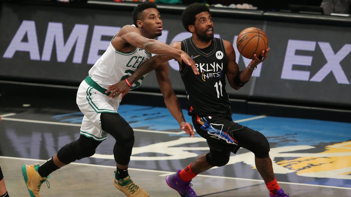 Brooklyn Nets point guard Kyrie Irving (11) and Boston Celtics small forward Aaron Nesmith (26)