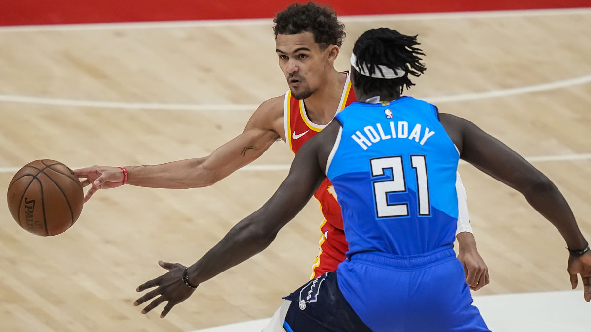 Atlanta Hawks guard Trae Young and Milwaukee Bucks guard Jrue Holiday