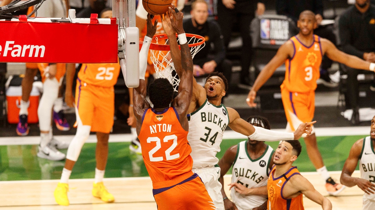 Milwaukee Bucks forward Giannis Antetokounmpo (34) and Phoenix Suns center Deandre Ayton (22)