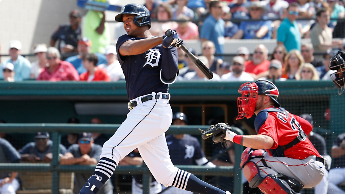 Detroit Tigers second baseman Jonathan Schoop (8) and Boston Red Sox catcher Kevin Plawecki (right)