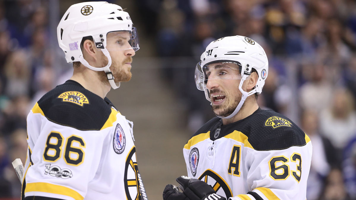 Former Boston Bruins defenseman Kevan Miller and Bruins left wing Brad Marchand