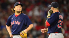 Boston Red Sox infielder Christian Arroyo and pitcher Hirokazu Sawamura