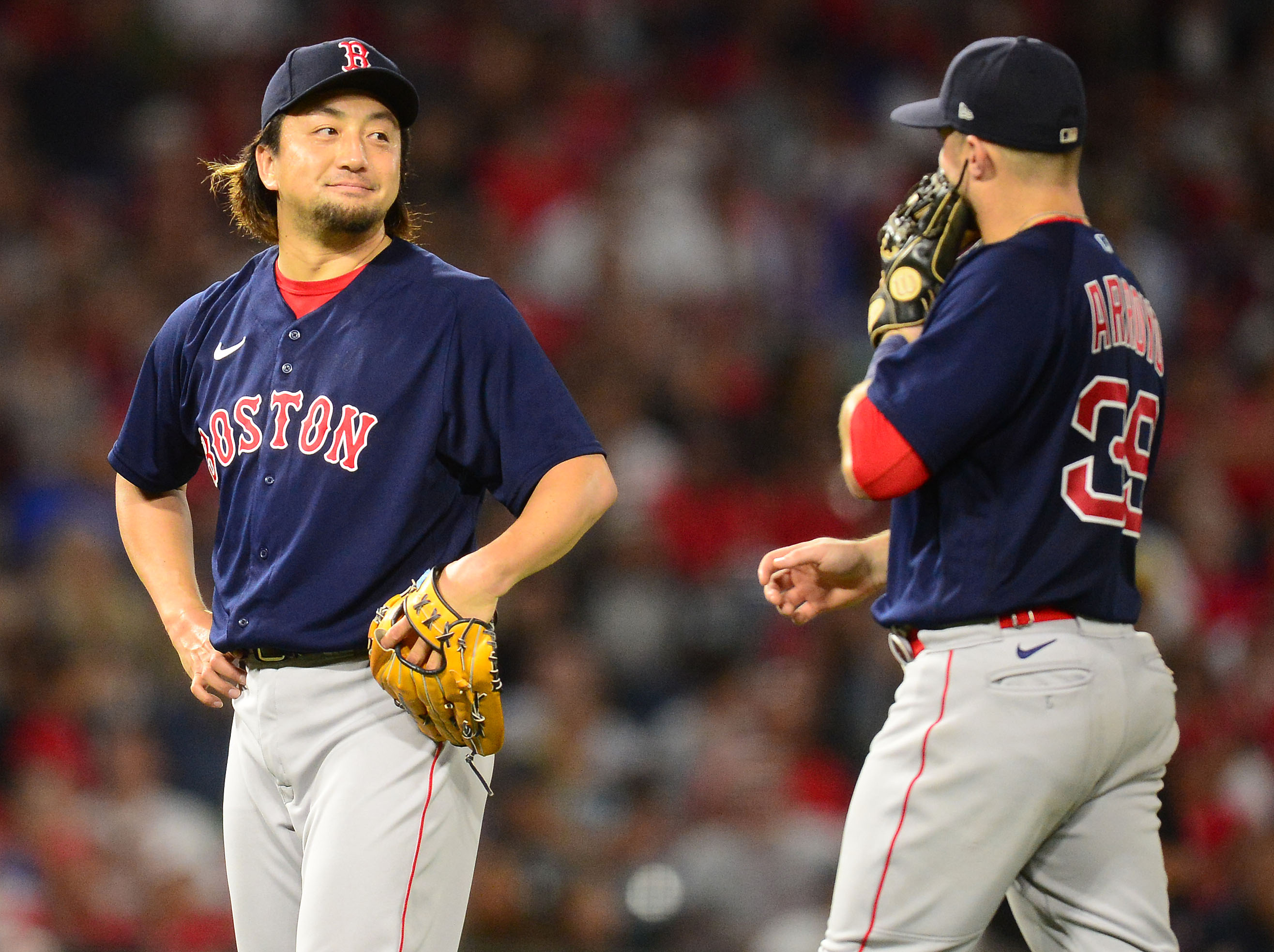 Boston Red Sox infielder Christian Arroyo and pitcher Hirokazu Sawamura
