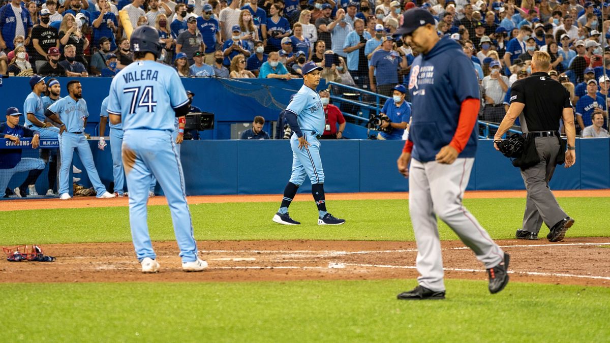 Toronto Blue Jays manager Charlie Montoyo and Boston Red Sox manager Alex Cora