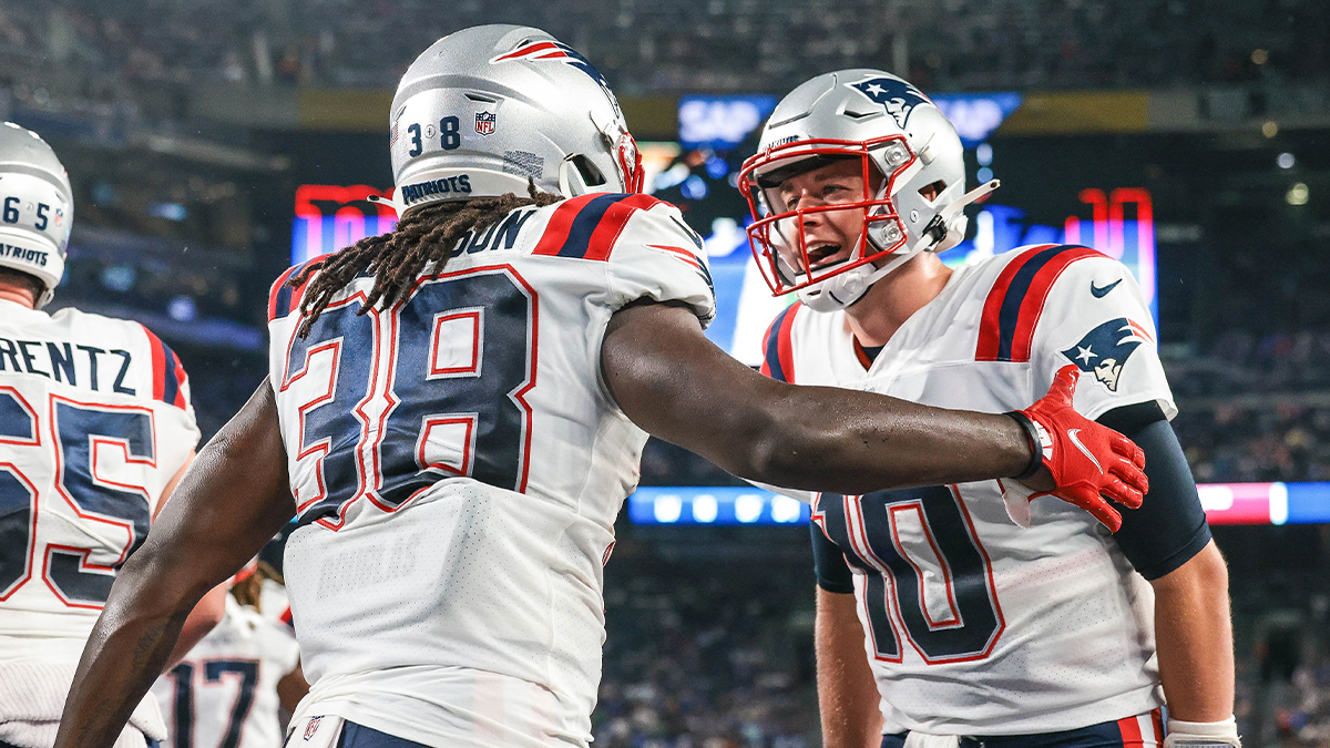 New England Patriots running back Rhamondre Stevenson and quarterback Mac Jones