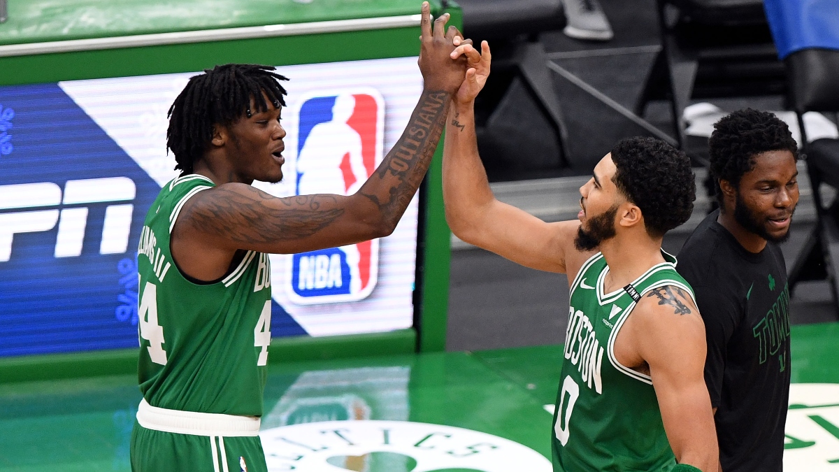 Boston Celtics forward Jayson Tatum (0) and center Robert Williams III (44)