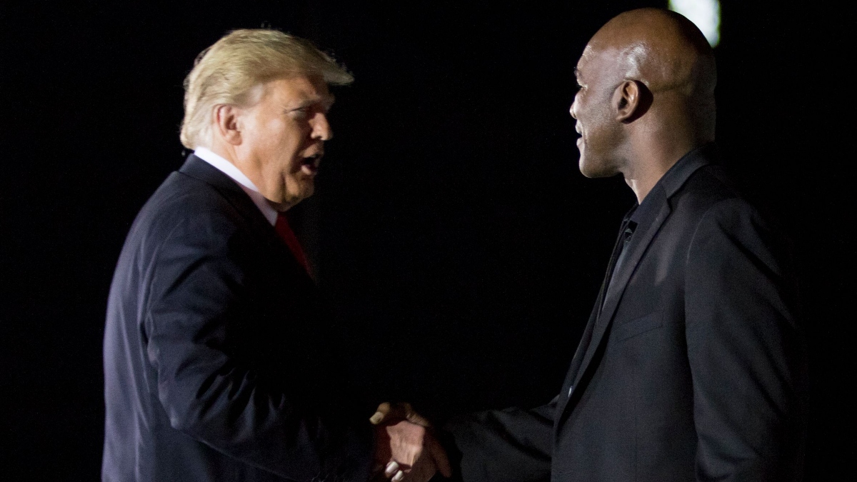 Former U.S. president Donald Trump and boxer Evander Holyfield (right)