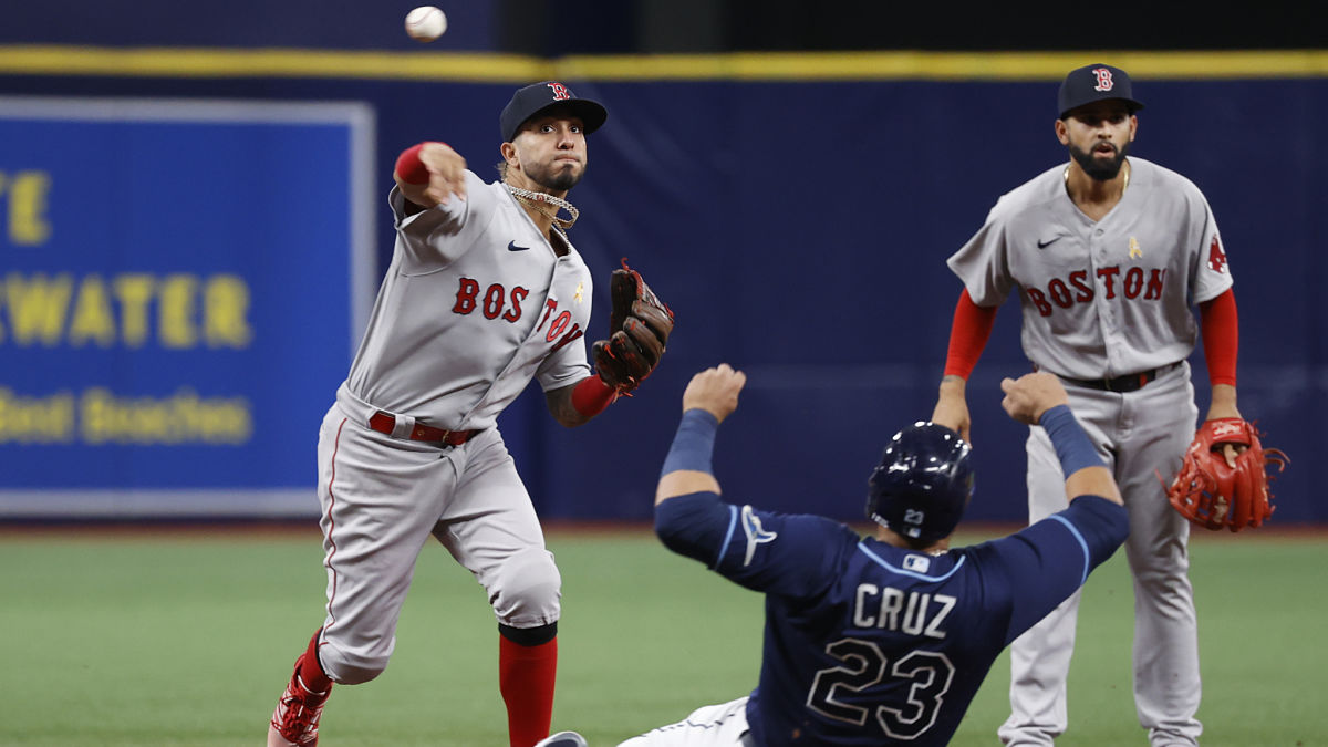 Boston Red Sox infielder Jonathan Araúz and Tampa Bay Rays designated hitter Nelson Cruz
