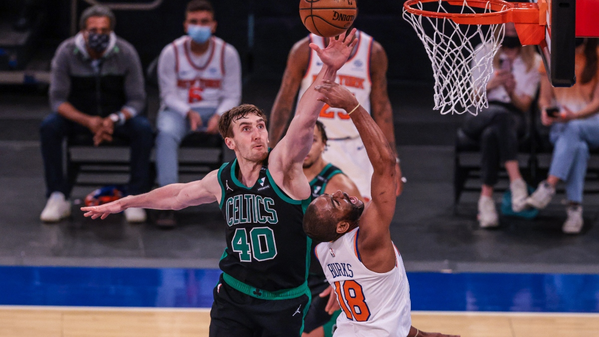 Boston Celtics center Luke Kornet (40) and New York Knicks guard Alec Burks (18)