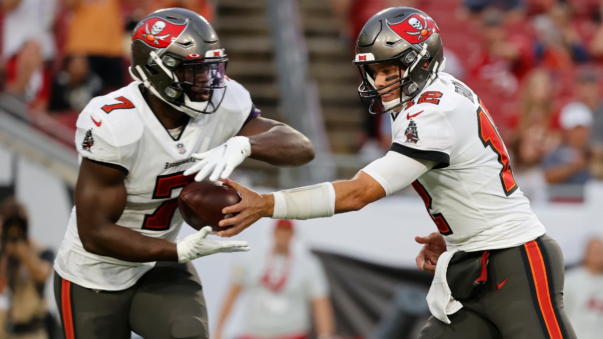 Tampa Bay Buccaneers quarterback Tom Brady (12) and running back Leonard Fournette (7)