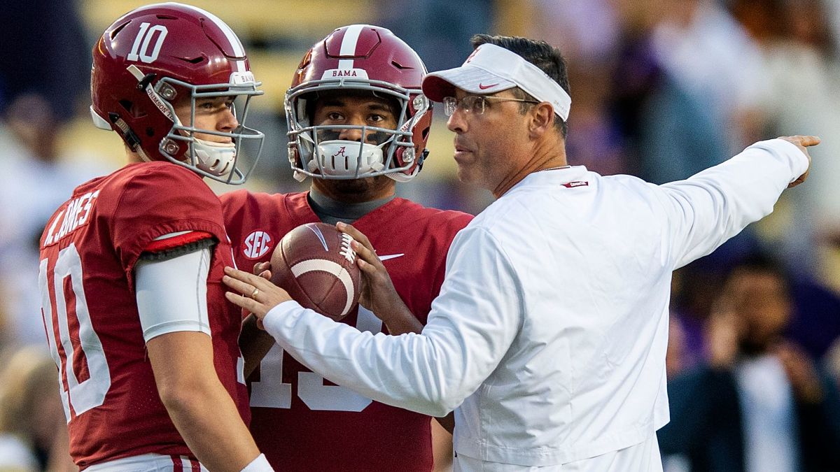 New England Patriots quarterback Mac Jones and Miami Dolphins quarterback Tua Tagovailoa