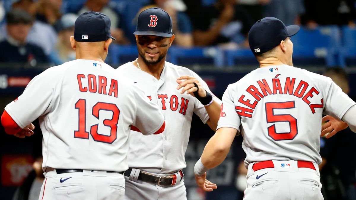 Boston Red Sox manager Alex Cora, shortstop Xander Bogaerts, utility player Kiké Hernámdez