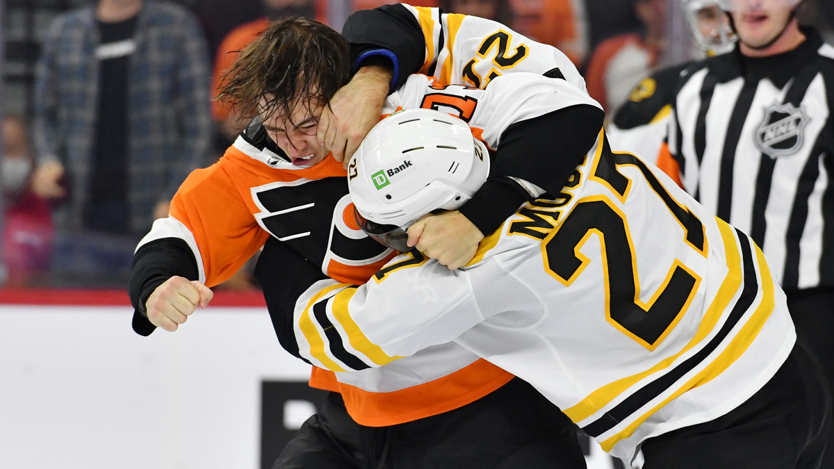 Philadelphia Flyers forward Elliot Desnoyers, Boston Bruins defenseman John Moore