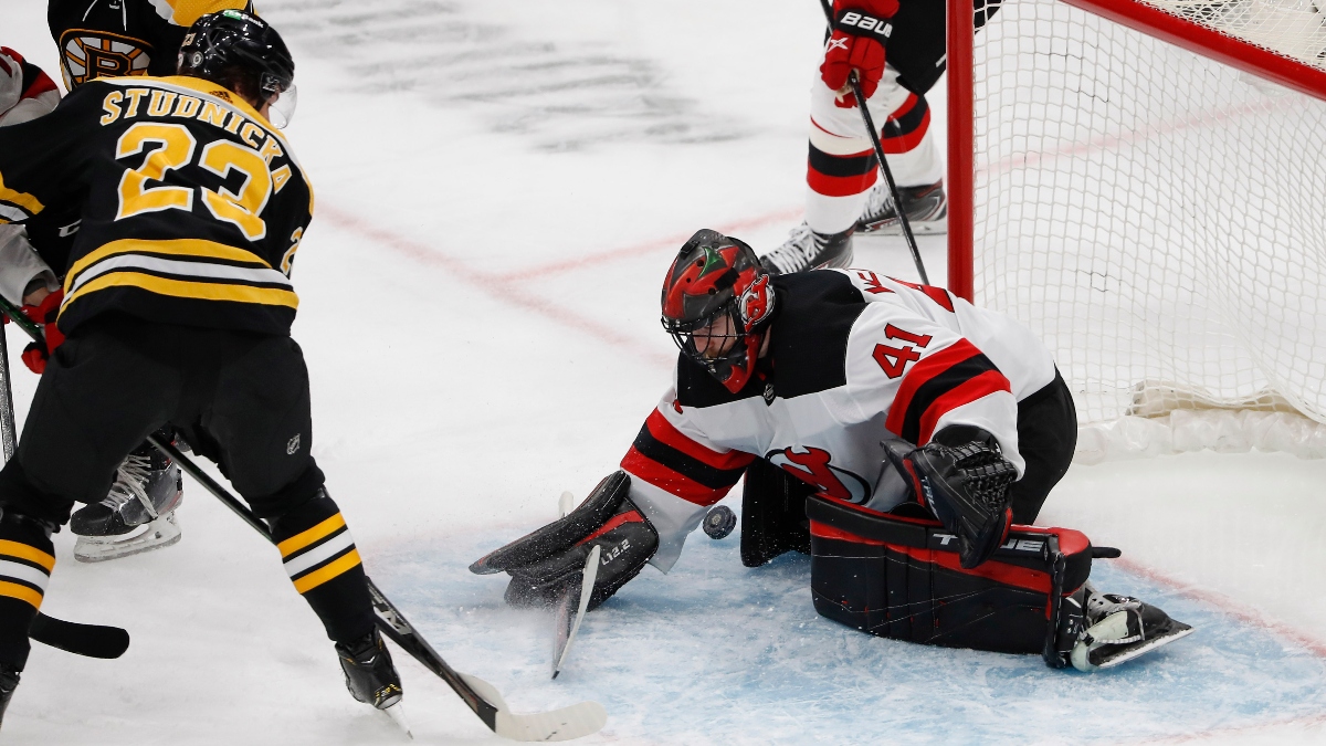 New Jersey Devils goaltender Scott Wedgewood (41) makes a save on Boston Bruins center Jack Studnicka (23)
