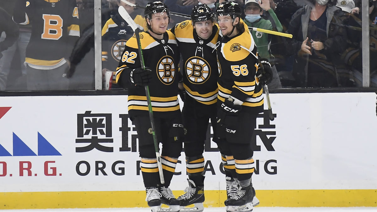 Boston Bruins players Jake DeBrusk, Oskar Steen and Erik Haula
