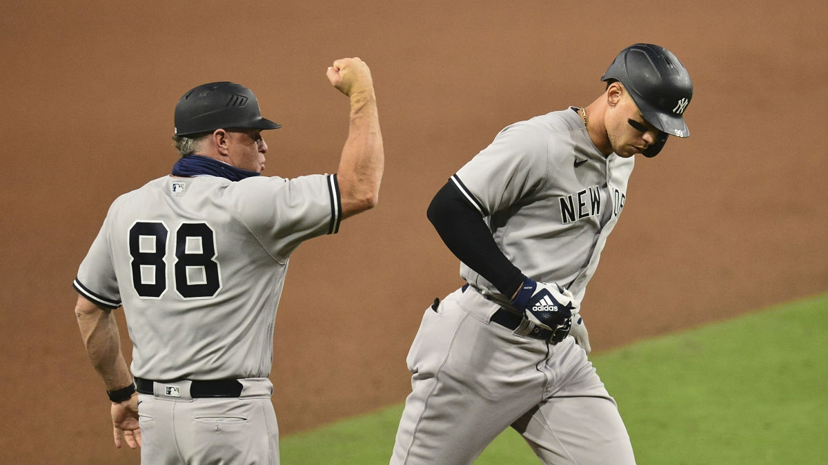 New York Yankees third base coach Phil Nevin, outfielder Aaron Judge