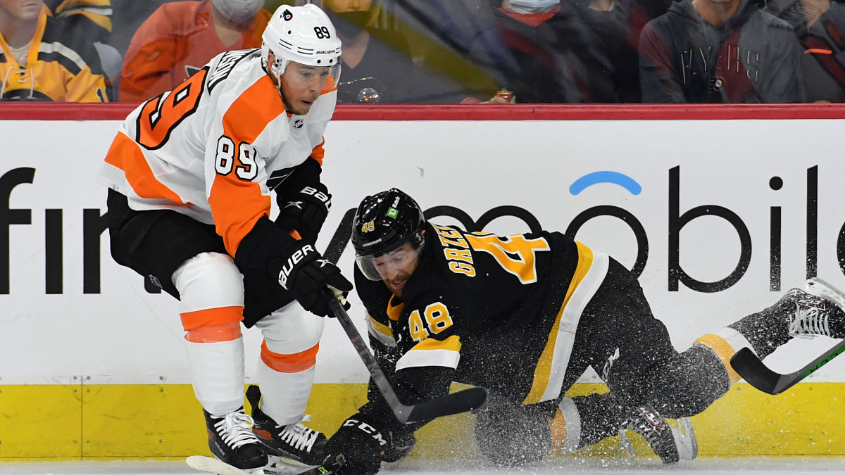 Boston Bruins defenseman Matt Grzelcyk, Philadelphia Flyers' Cam Atkinson