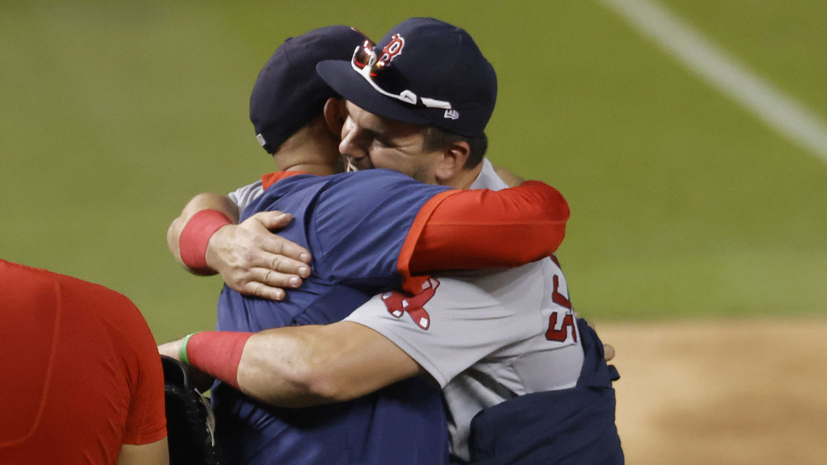 Red Sox left fielder Kyle Schwarber, manager Alex Cora