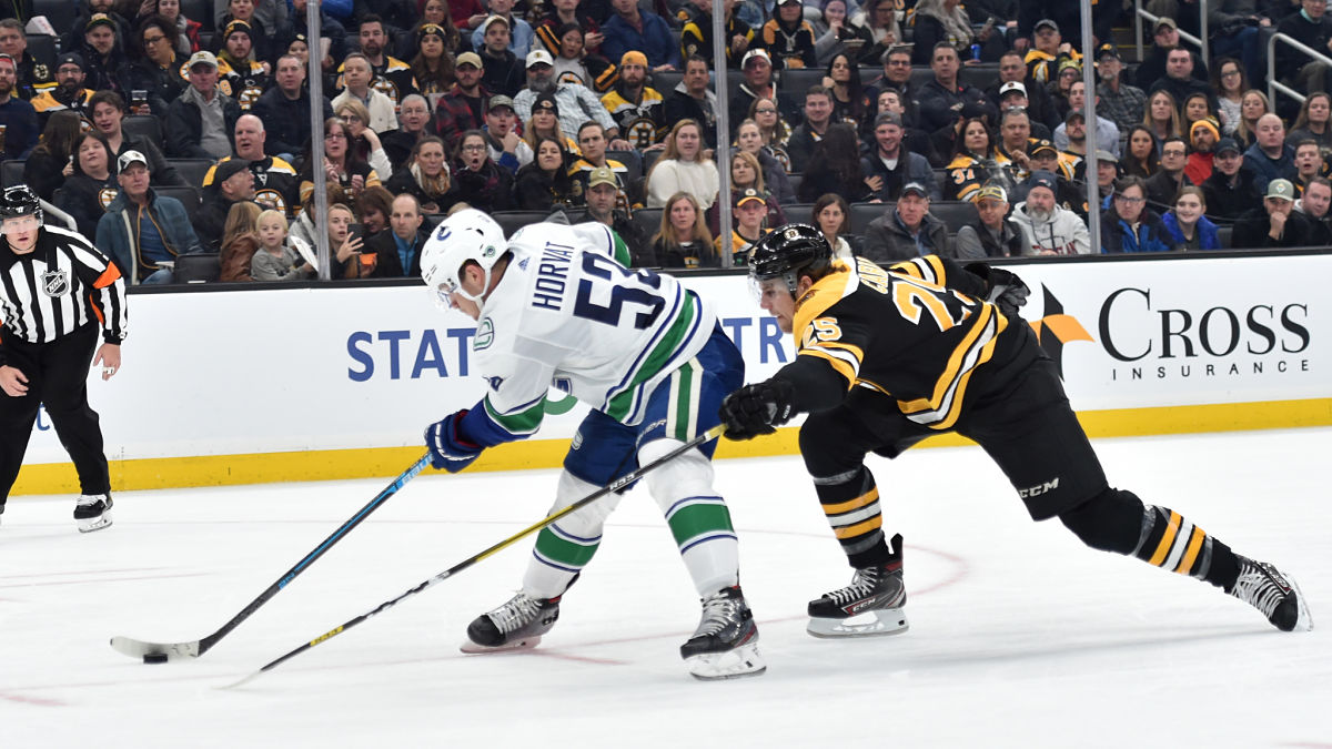 Vancouver Canucks center Bo Horvat and Boston Bruins defenseman Brandon Carlo