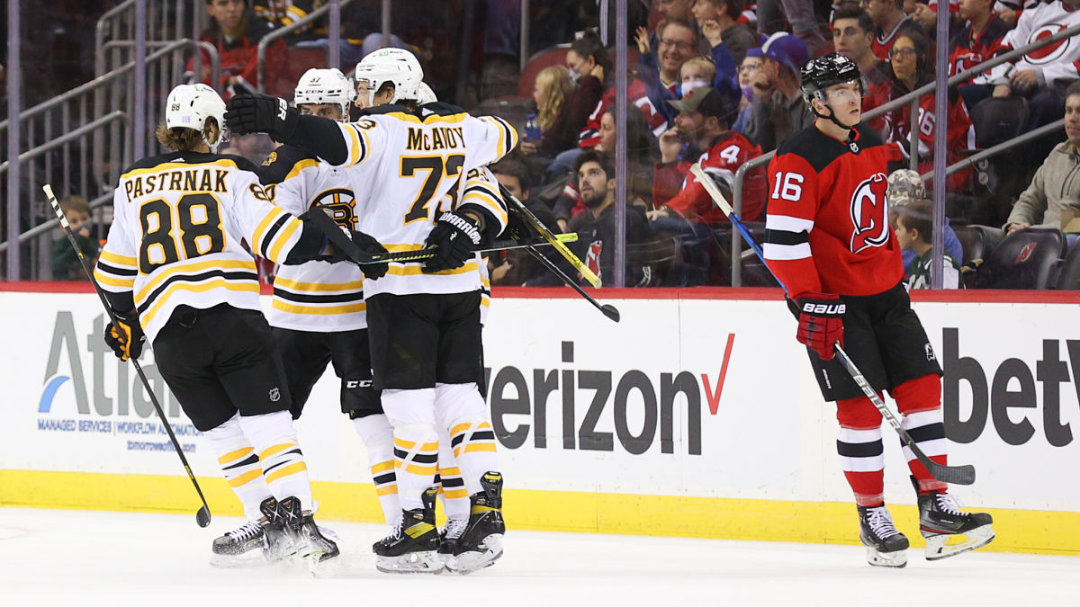 Boston Bruins players celebrate after goal
