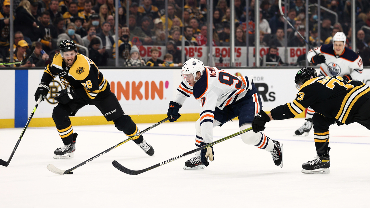 Edmonton OIlers forward Connor McDavid, Boston Bruins defensemen Charlie McAvoy and Derek Forbort
