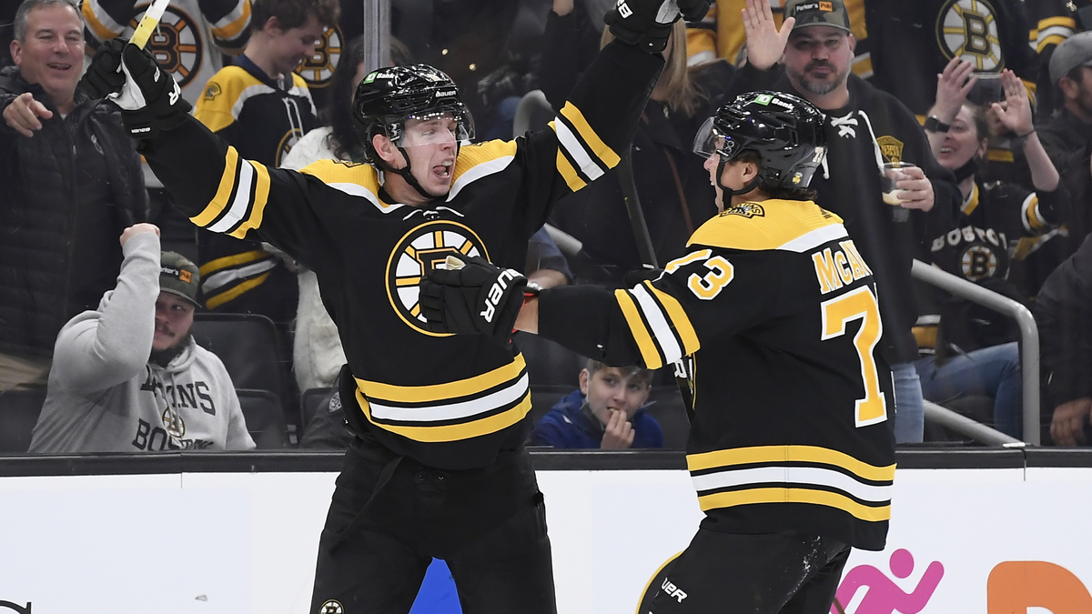 Boston Bruins defensemen Mike Reilly and Charlie McAvoy