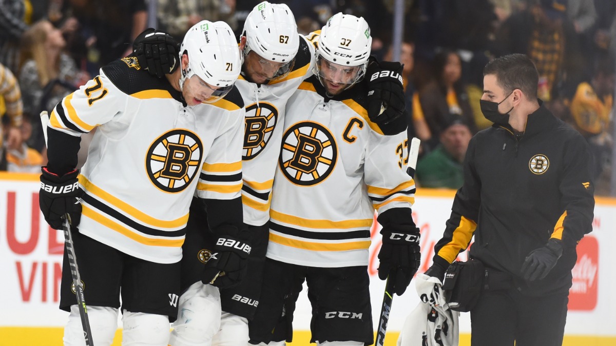 Boston Bruins defenseman Jakub Zboril, forwards Patrice Bergeron and Taylor Hall
