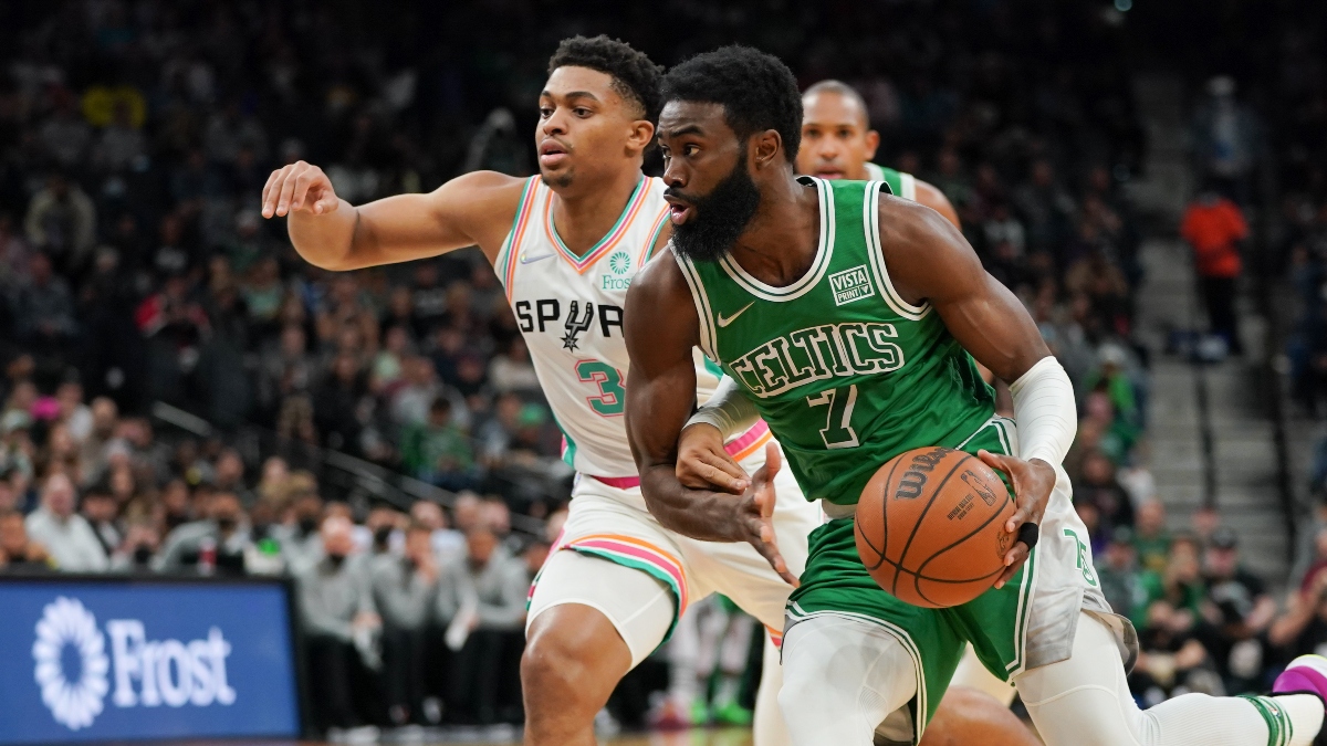Boston Celtics guard Jaylen Brown (7) and San Antonio Spurs forward Keldon Johnson (3)
