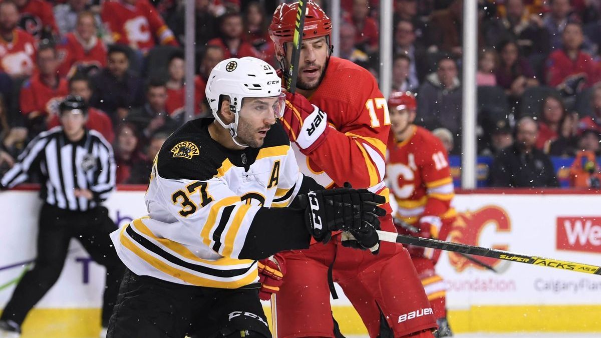 Boston Celtics' Patrice Bergeron, Calgary Flames' Milan Lucic
