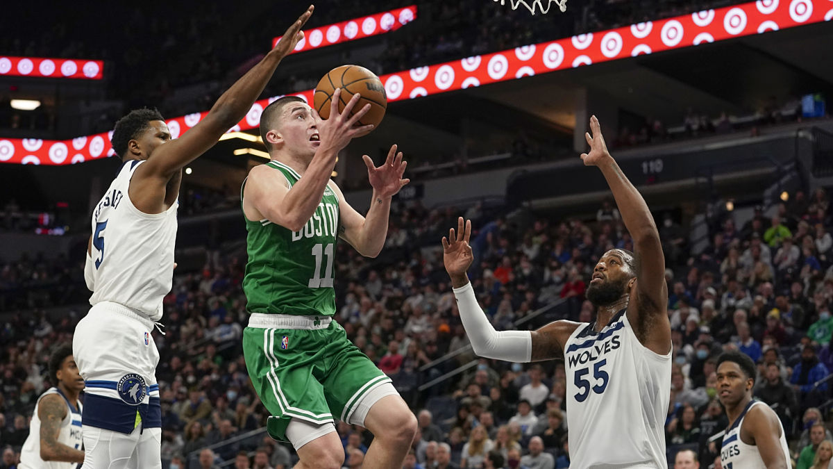 Boston Celtics guard Payton Pritchard and Minnesota Timberwolves center Greg Monroe