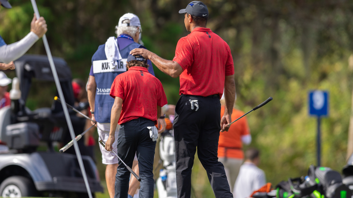 Golfers Tiger Woods, Charlie Woods