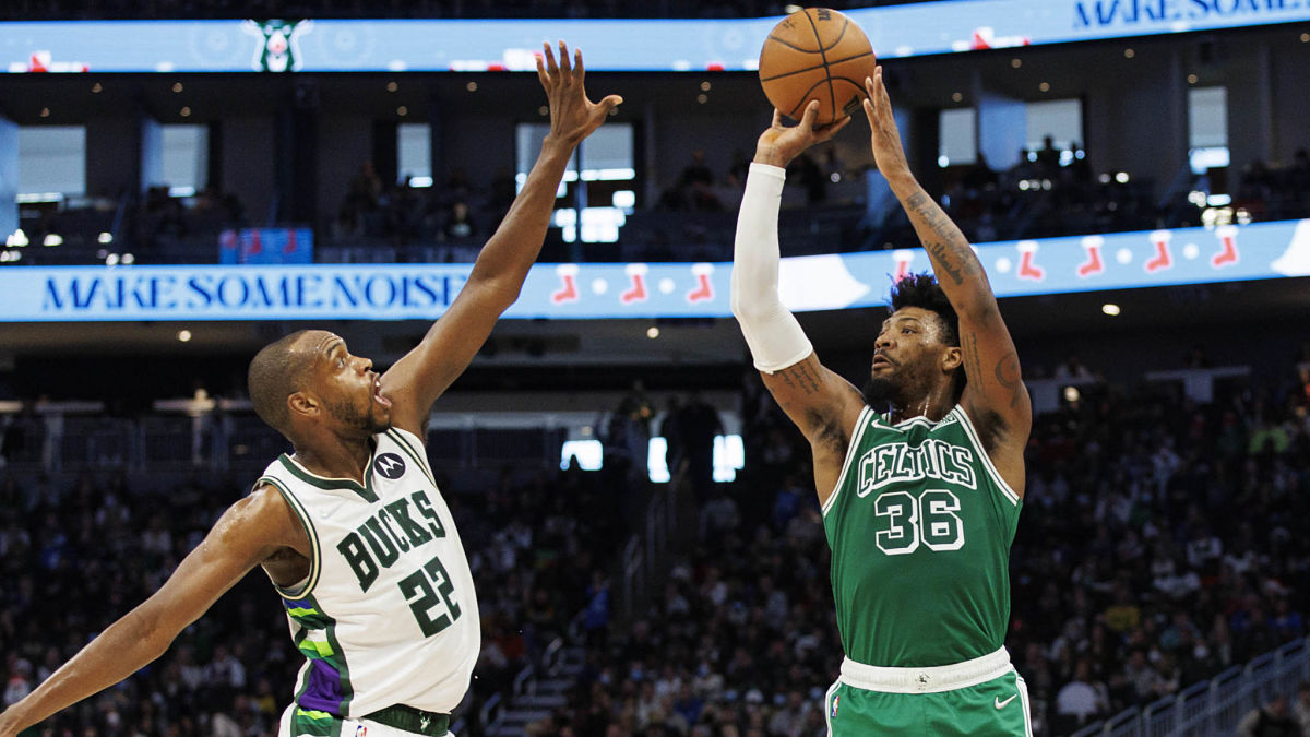 Boston Celtics guard Marcus Smart, Milwaukee Bucks forward Khris Middleton