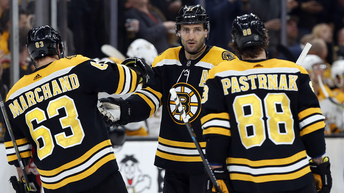 Boston Bruins forwards Brad Marchand, Patrice Bergeron, David Pastrnak