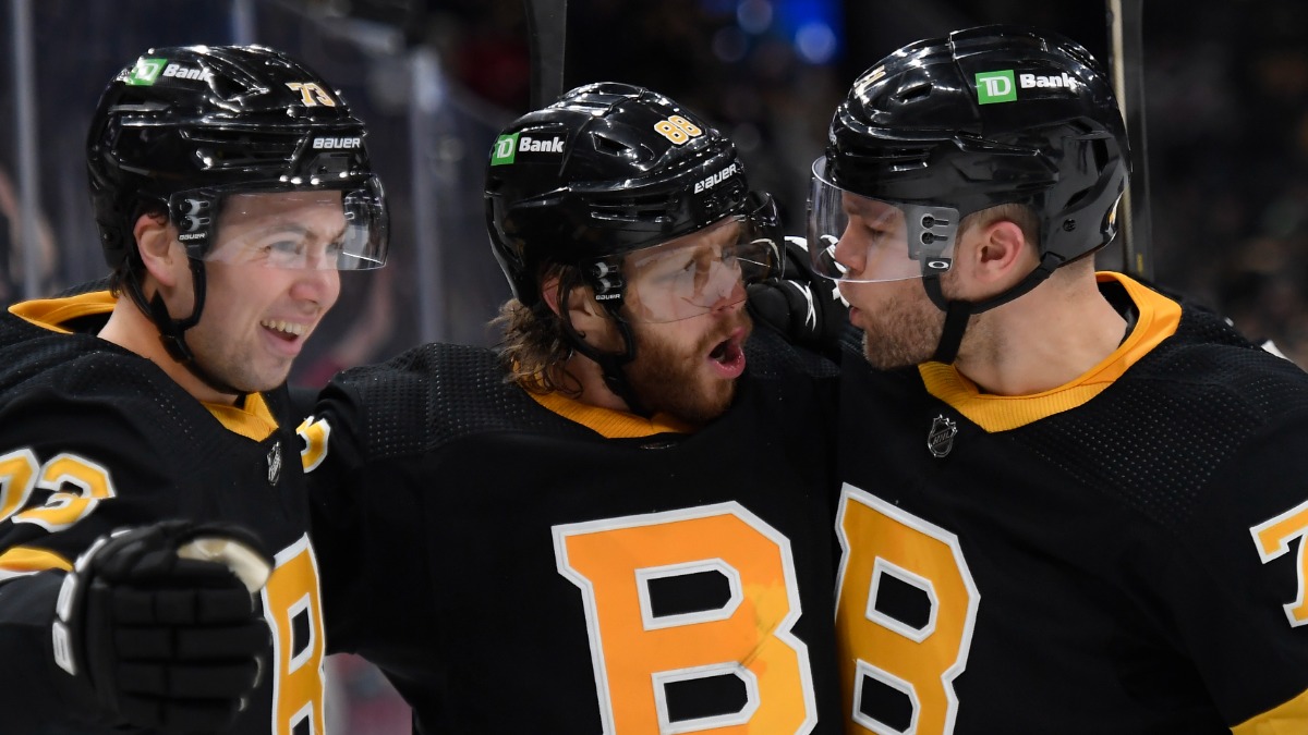 Boston Bruins defenseman Charlie McAvoy and forwards David Pastrnak, and Taylor Hall