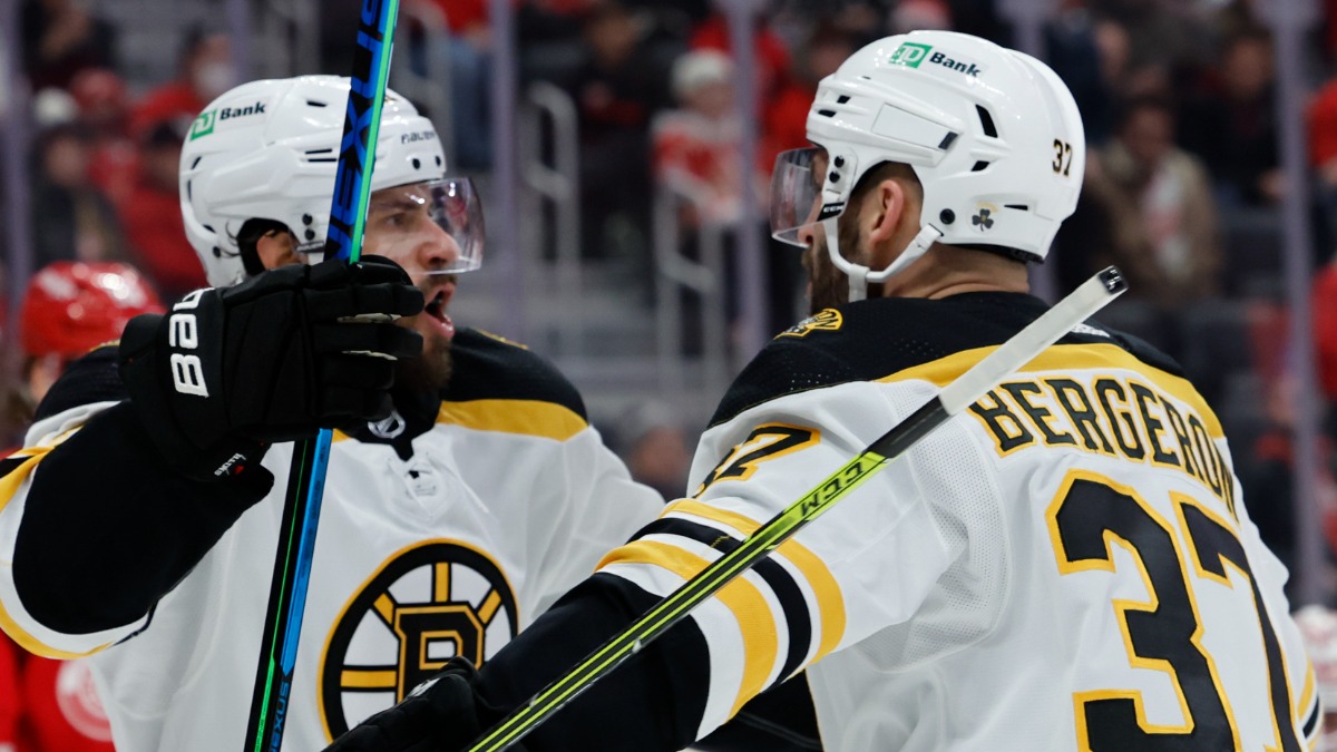 Boston Bruins forwards Patrice Bergeron and Craig Smith