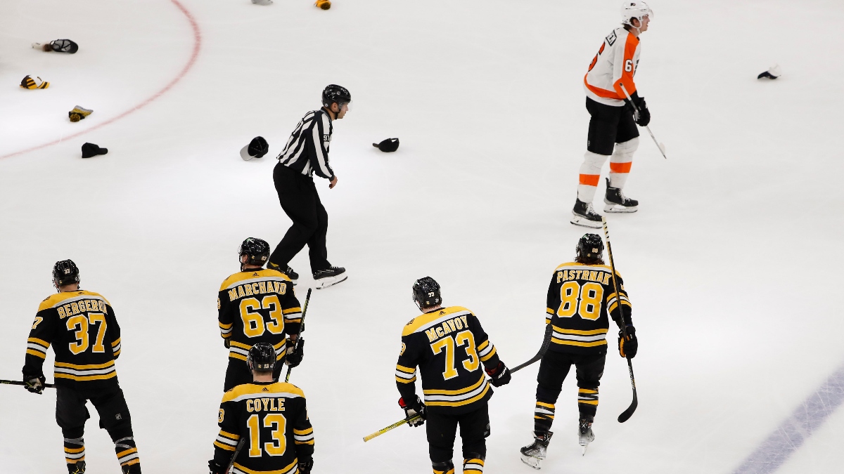 Boston Bruins right wing David Pastrnak (88), center Patrice Bergeron (37), left wing Brad Marchand (63), center Charlie Coyle (13) and defenseman Charlie McAvoy (73) and Philadelphia Flyers defenseman Travis Sanheim (6)