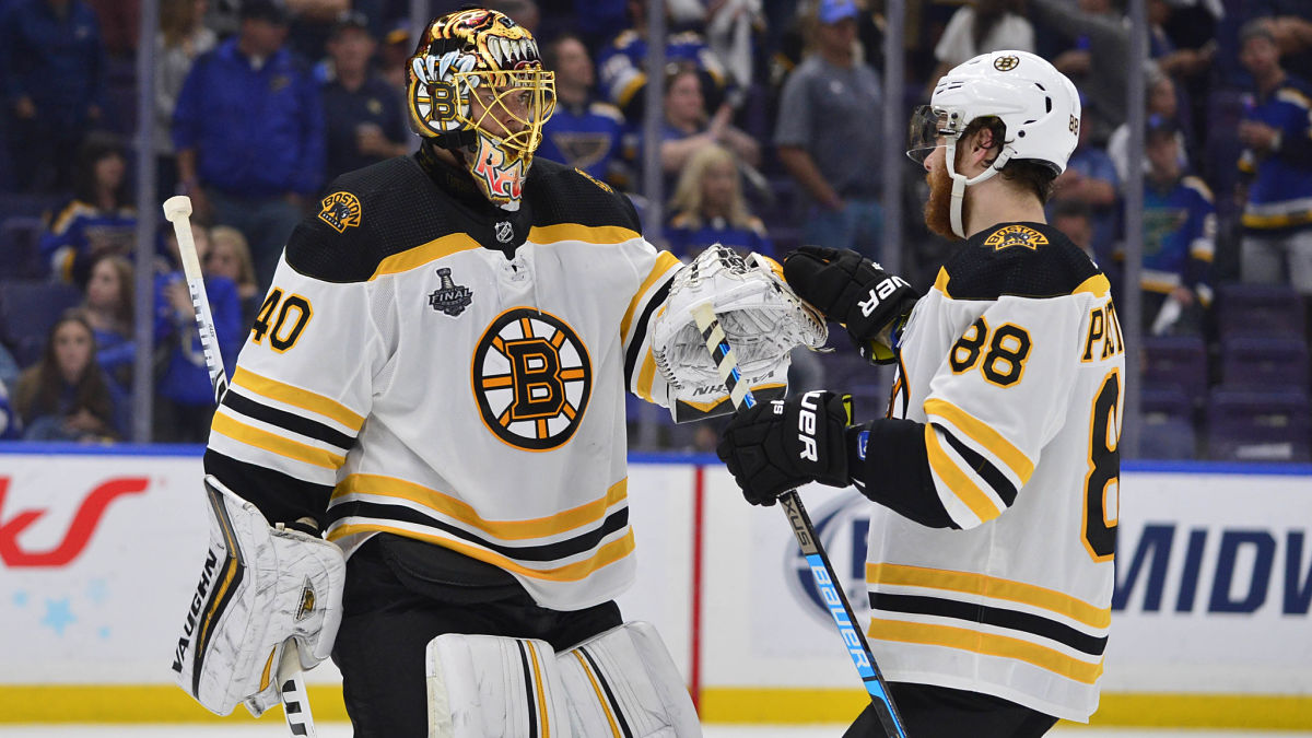 Boston Bruins goaltender Tuukka Rask and forward David Pastrnak