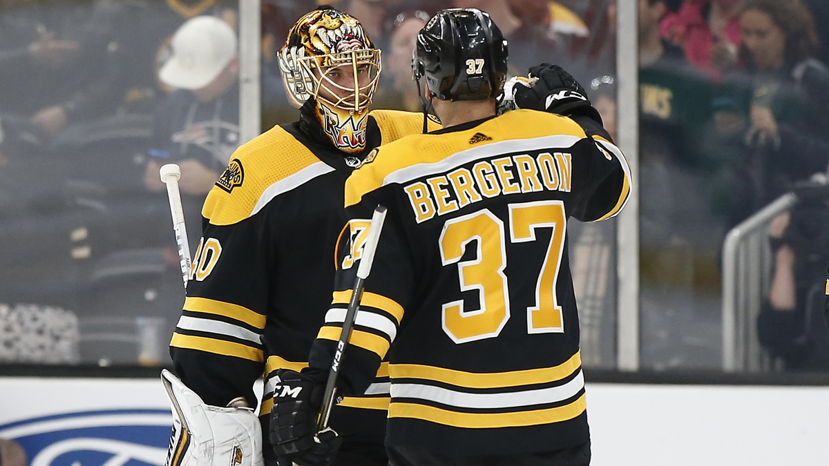 Boston Bruins goalie Tuukka Rask, center Patrice Bergeron