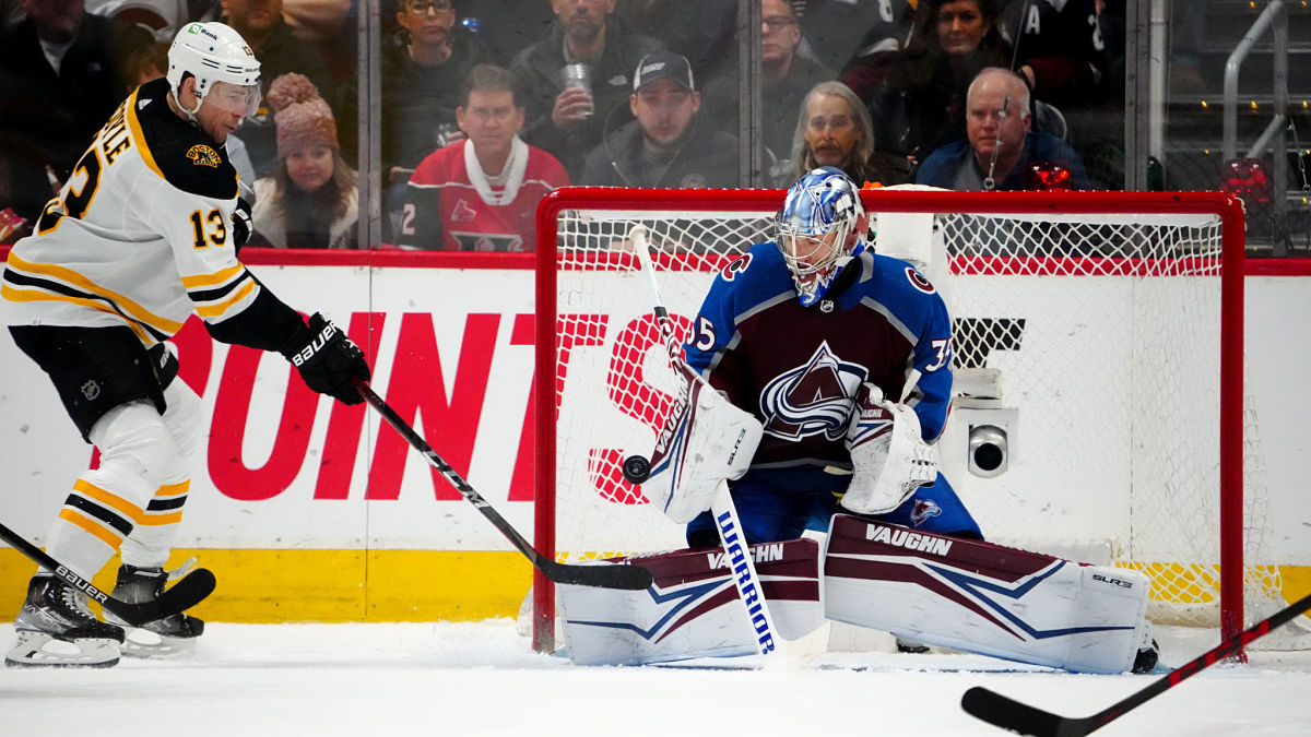 Boston Bruins center Charlie Coyle and Colorado Avalanche goalie Darcy Kuemper
