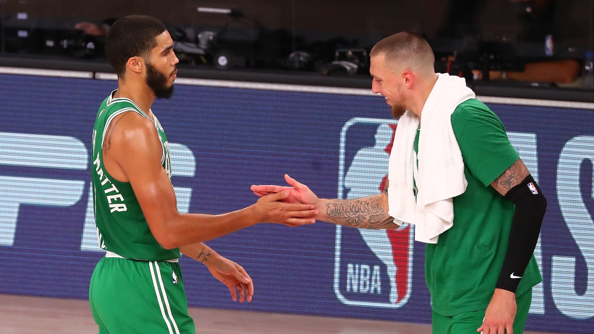 Boston Celtics forward Jayson Tatum (left) and center Daniel Theis (right)
