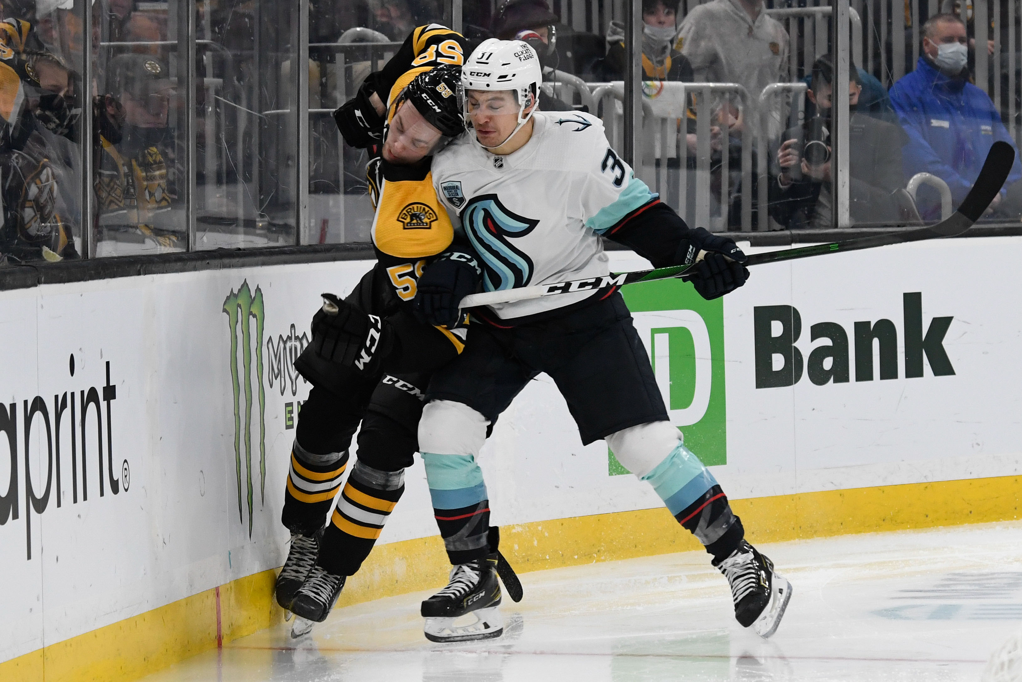 Seattle Kraken center Yanni Gourde, Boston Bruins defenseman Urho Vaakanainen