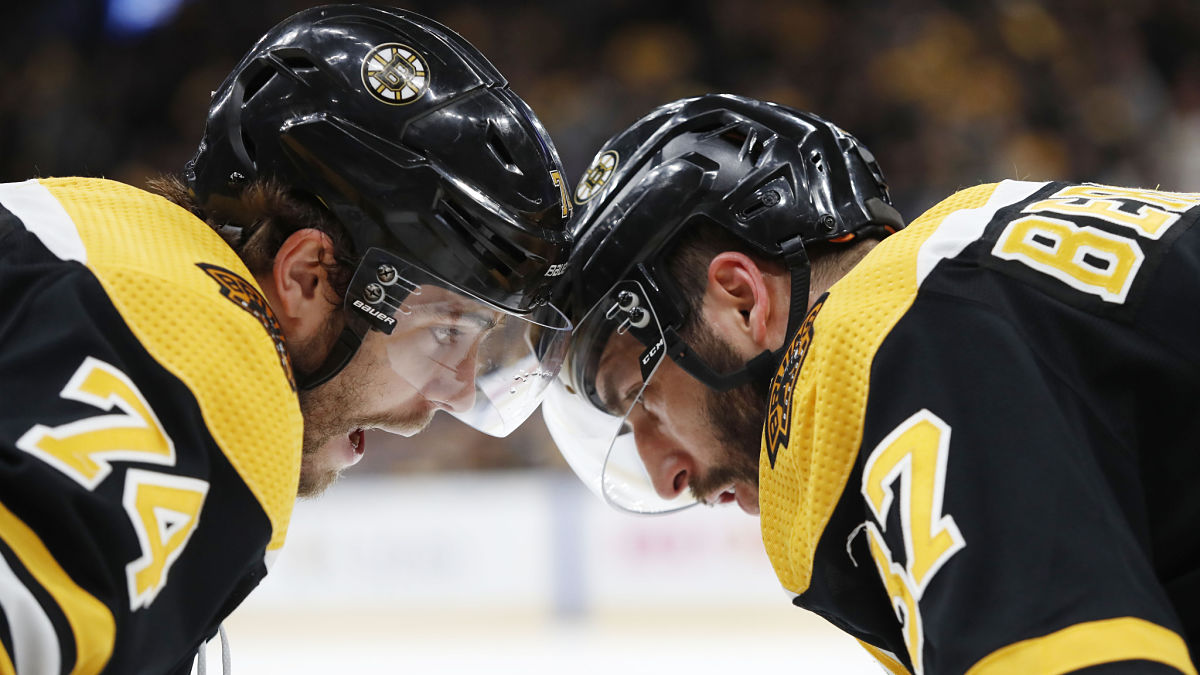 Boston Bruins winger Jake DeBrusk, center Patrice Bergeron