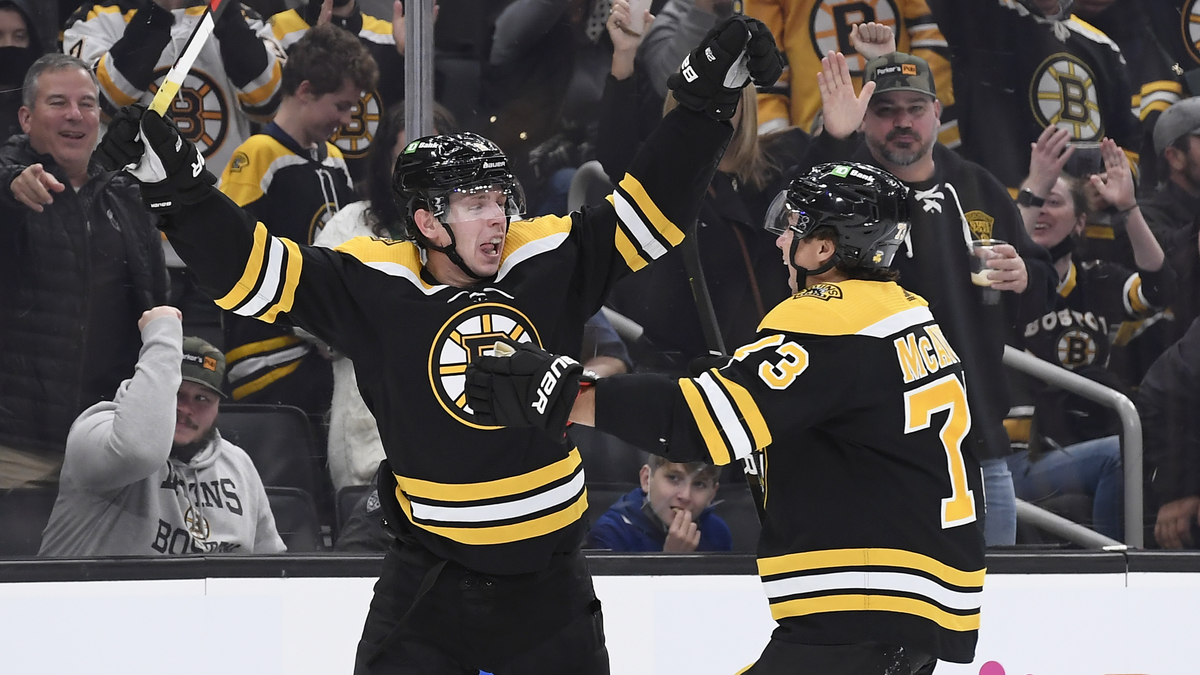 Boston Bruins defensemen Mike Reilly, Charlie McAvoy